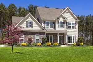 Beige Home with a Grassy Lawn